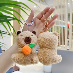 Süßer Capybara-Plüsch-Schlüsselanhänger mit Orange, weiches braunes Fell und Metallclip