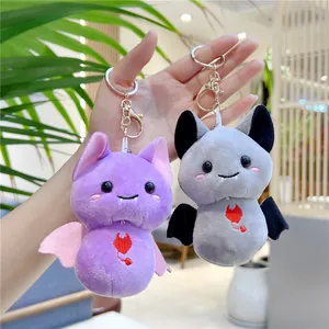 Cute plush cartoon bat keychains in purple and grey with heart embroidery detail