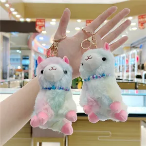 Colorful plush alpaca keychain charms with rainbow faux fur and gold metal lobster clasps