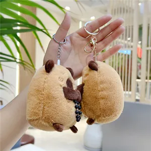 Close-up of cute plush capybara keychain with black beads and metal lobster clasp detail