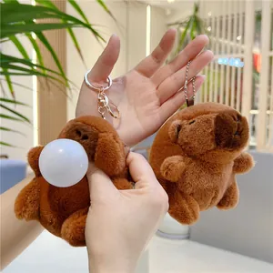 Porte-clés Capybara en peluche avec design de bulles et texture de fourrure marron