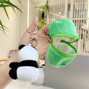 Detail of panda plush keychain with green bamboo-shaped coin purse and metal clasp