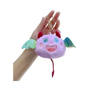 Porte-clés monstre en peluche violette avec ailes pailletées et mousqueton doré