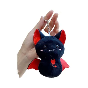 Cute black bat plush keychain with red accents and heart embroidery for bag decoration