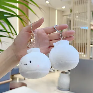 Porte-clés peluche petit pain blanc avec broderie sourire et clip métallique