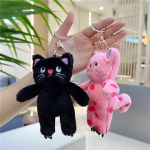 Plush pink polka dot and black cat keychain charms with golden metal lobster clasps