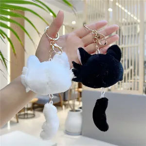 Cute black and white plush cat head keychains with long tails and gold metal rings