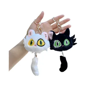 Cute black and white plush cat head keychains with gold metal rings and tails