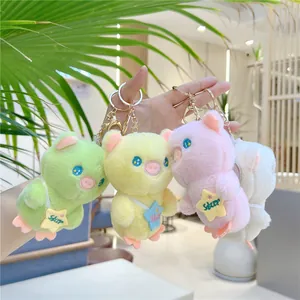 Detailed close-up of cute starry pig plush keychains in green, yellow, pink, and white