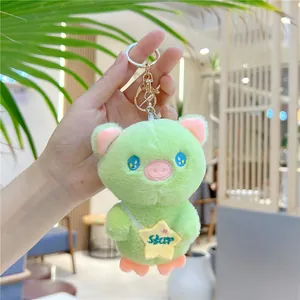 Cute green plush pig doll keychain with blue eyes and yellow star bag for gift decor