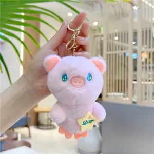 Pink plush pig keychain with star bag and gold clip for kids and gift giving