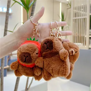 Set of 3 plush Capybara keychains with strawberry hat and golden rings hand-held display
