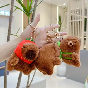 Three cute Capybara plush keychains with strawberry hat and turtle backpack designs
