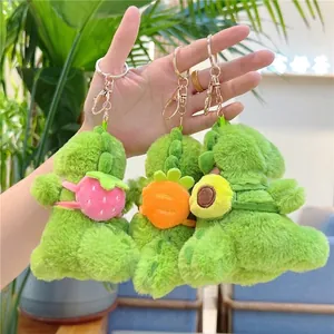 Plush dinosaur keychains with fruit motifs including strawberry, carrot and avocado
