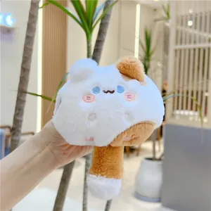 Macro detail of the plush cat accessory showing soft fur and exquisite embroidered face
