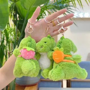 Three cute green plush dinosaur keychains with backpack accessories and gold metal rings
