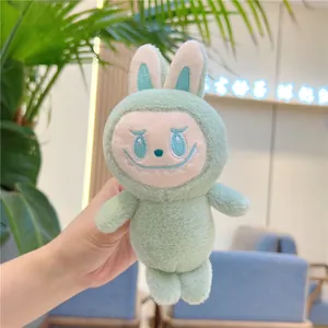 Close-up of mint green plush Labubu doll in rabbit outfit with soft fur details