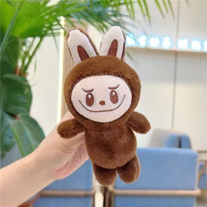 Detailed close-up of brown plush Labubu keychain with signature embroidery and sharp teeth