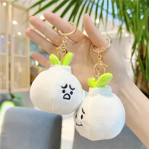 Cute garlic plush keychain with funny facial expressions and green leaves with golden clip