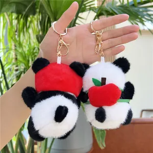 Plüsch Panda-Schlüsselanhänger mit rotem Apfel und Mütze an goldenem Karabinerhaken