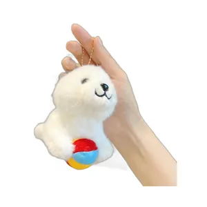 Cute white seal plush keychain holding colorful ball, fluffy sea animal bag charm pendant