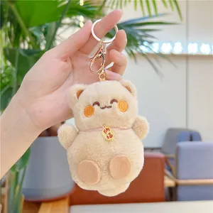 Porte-clés ours en peluche beige avec fermoir en métal doré et pendentif Nafu