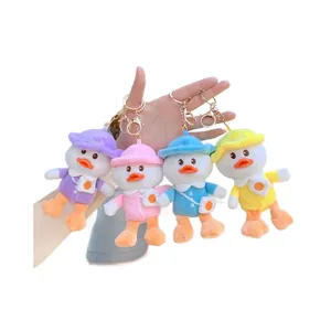 Cute plush duck keychains in purple, pink, blue and yellow with embroidered hats
