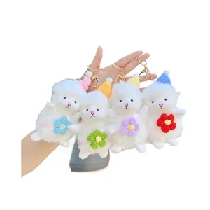 Set of four plush sheep keychains with colorful knit hats and golden metal clasps