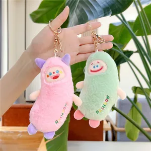 Cute plush bird keychain in pink and green with rainbow embroidery and gold rings