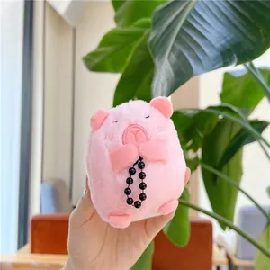 Pink Capybara plush keychain detail showing prayer hands with black prayer beads