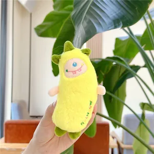 Cute yellow banana monster plush toy keychain with green accents and rainbow embroidery