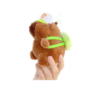 Plush Capybara keychain with white cap and green backpack for bags and gift accessories