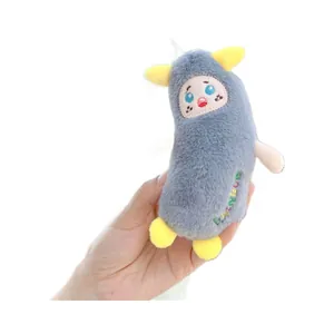 Cute grey fluffy monster plush keychain with yellow feet and colorful side embroidery