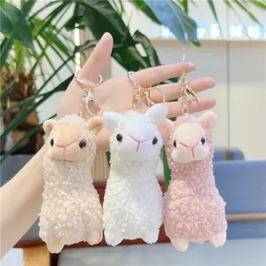 Cute alpaca plush keychain set in white, brown and pink with golden metal hardware