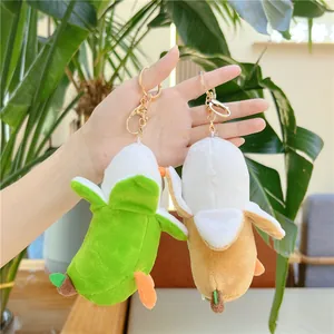 Portachiavi a forma di anatra banana in peluche con bucce verdi e gialle e ganci dorati