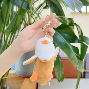 Portachiavi peluche anatra banana con design a frutto sbucciato e dettagli arancioni vivaci