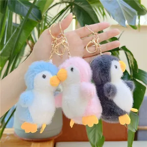 Cute fluffy penguin plush keychain charms in blue, pink and grey for bags