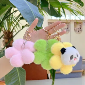 Three plush flower charms in pink green and yellow featuring a cute panda on golden keychain