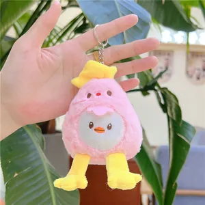 Detailed close-up of a pink plush chick keychain held in hand to show size and texture