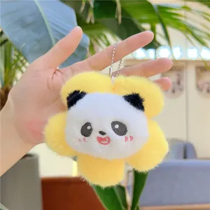 Close-up of a plush panda charm inside a yellow flower petal with silver ball chain