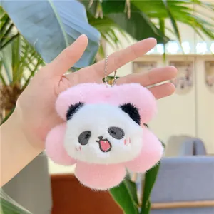 Detailed close-up of a plush red panda flower pendant with soft pink petals and metal chain
