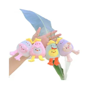 Cute plush egg-shaped chick and pig keychain set in blue, pink, green, and purple colors