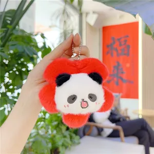 Close-up of cute panda flower plush keychain with red petals and soft white fur