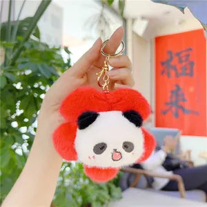 Detail of red flower panda plush keychain with soft fur texture and metal ring