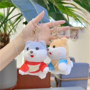 Cute plush puppy keychain wearing a colorful hoodie with a silver metal lobster clasp