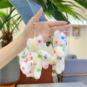 Ciondoli a gatto in peluche bianco con pois colorati e chiusura a moschettone dorata