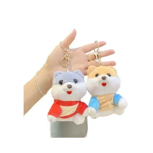 Cute plush dog keychain set featuring pilot outfits and golden lobster clasps for bags