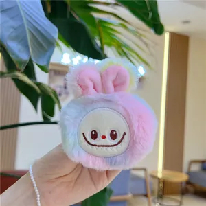 Handheld view of a colorful gradient plush rabbit charm with soft faux fur texture