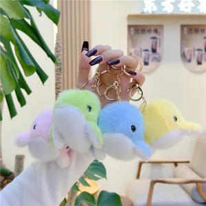 Plush dolphin keychain in pastel colors with gold metal rings for bag decoration