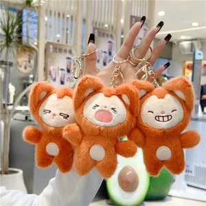 Detailed view of three cute plush fox keychains with distinct facial expressions